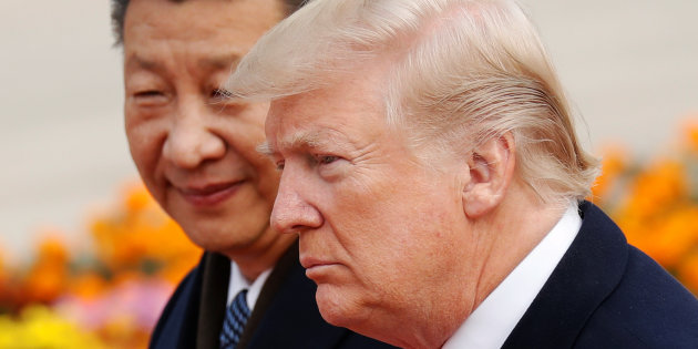 U.S. President Donald Trump takes part in a welcoming ceremony with China's President Xi Jinping in Beijing